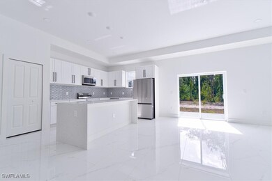 Kitchen with appliances with stainless steel finis