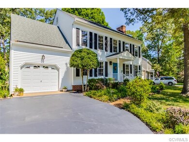 This home's paved driveway leads directly to its a
