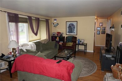 Spacious living room with hardwood floors
