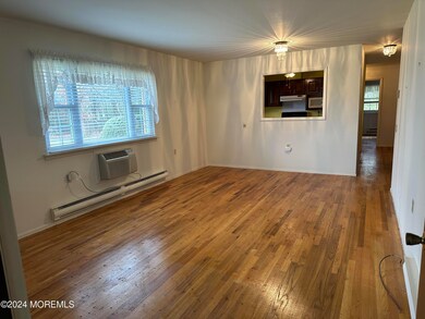 Living and dining room with exposed wood