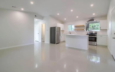 Kitchen featuring stainless steel appliances, fin