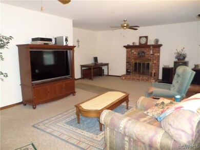 Large 25 x 13 living room with wood burning firepl