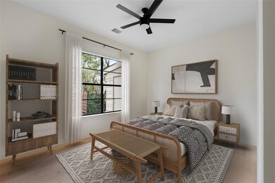 Bedroom with light wood-style flooring and ceiling fan