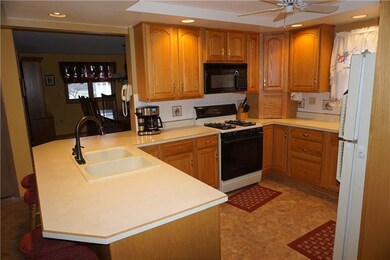 The 17x10 Eat-in Kitchen features oak cabinetry an