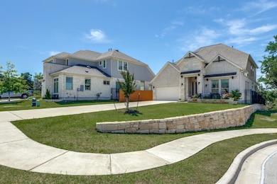 View of front of house with concrete driveway and