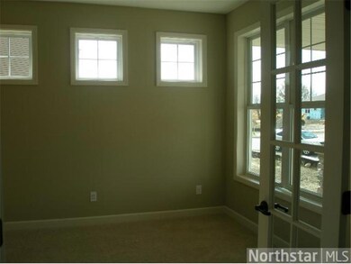 Sunny main floor den with french doors off foyer.