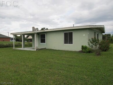 Carport leads to utility/laundry room