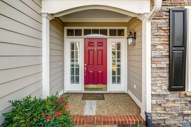 Covered front porch with sidelights.