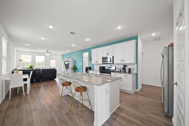 Another view of the kitchen highlights the open-co
