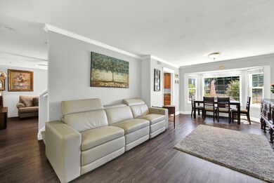 The formal living/dining room combination leads to the galley style kitchen and to a second living and dining area.
