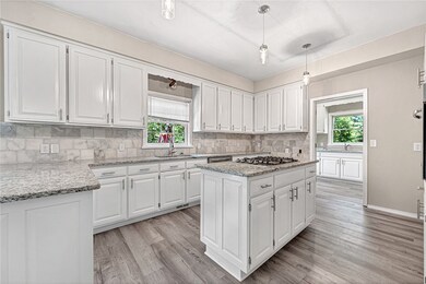 Note new counter tops, new back splash, all new ca