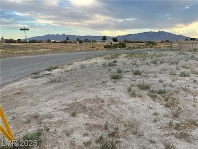 View of mountain backdrop with rural landscape
