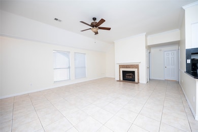 The living area boasts a cozy fireplace, perfect for relaxing evenings at home