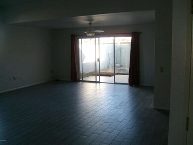 LIVING ROOM WITH TILE PATIO SHOWN