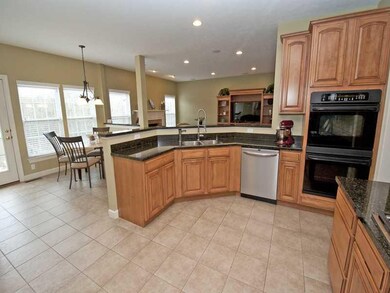 Kitchen. The kitchen is open and bright with plent