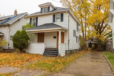 Traditional style home with a porch and a shingled roof