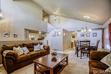 Formal living room & dining room with volume ceili