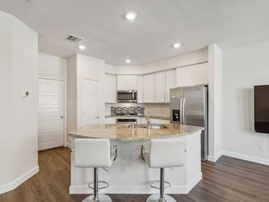 Kitchen featuring a sink, appliances with stainles