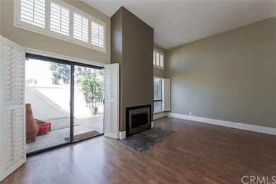 Light, Bright Living Room with Fireplace and Plant