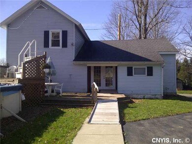 Exterior Back Nice deck leading to pool and garage