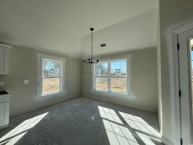 Unfurnished dining area with a chandelier