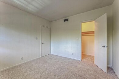 Spacious second bedroom with walk in closet and ne
