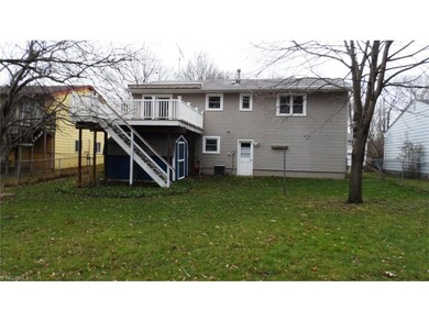 Fenced back yard with deck and shed