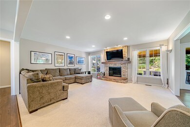Large windows overlook outdoor living space