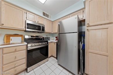 KITCHEN WITH NEWER STAINLESS APPLIANCES