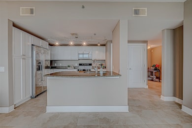 Spacious open-concept kitchen with elegant white c