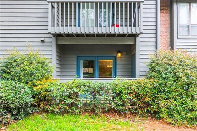 Property entrance featuring a balcony and brick si