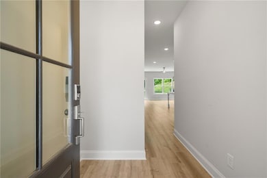 Corridor featuring light hardwood / wood-style flo