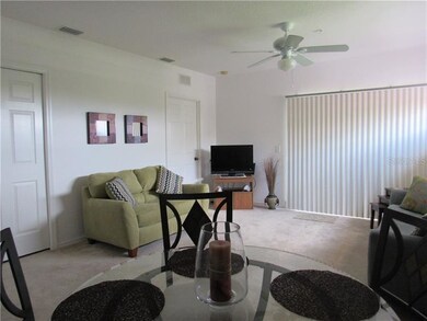 Nicely outfitted living room with comfy love seat 