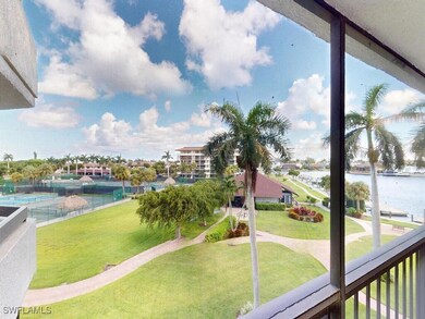 View of home's community featuring a lawn and a wa