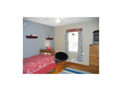 Second bedroom looks out over patio and backyard.