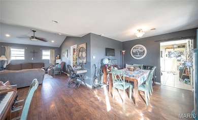 Dining area featuring vaulted ceiling, wood finished floors, ceiling fan, and recessed lighting