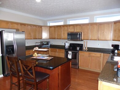 The kitchen is huge!! There is tons of cabinet and counter space, granite counters, a walk in pantry, island, and new microwave and dishwasher. 