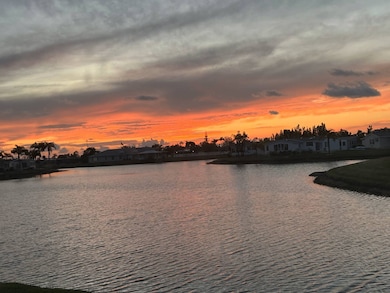 SUNSET OVER THE CLUBHOUSE FROM LANAI