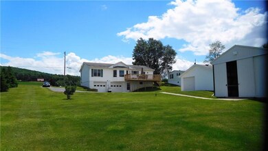 View of the back of the house. Note garage under h