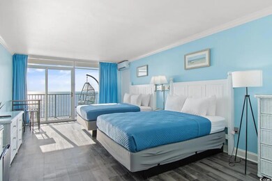 Bedroom with hardwood / wood-style floors, crown m