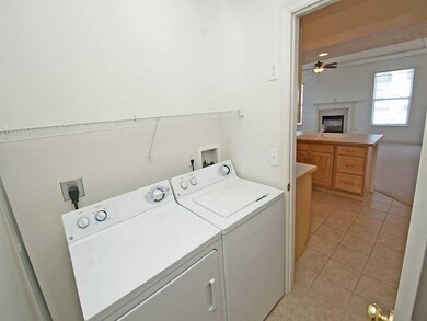 Other. Laundry room is located off of the kitchen.