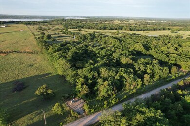 Aerial overview of property's location featuring a nearby body of water and rural landscape
