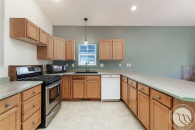 Kitchen with gas oven/stove.