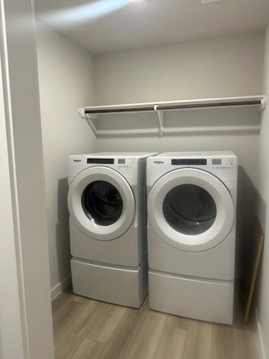 Laundry area featuring washing machine and dryer,
