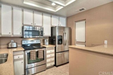 Recessed lighting, tile flooring, designer two ton