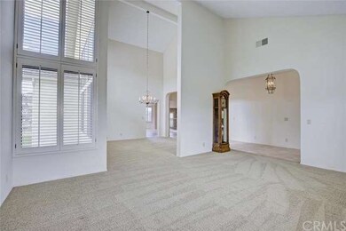 Livingroom, dining room and entry. Notice high cei