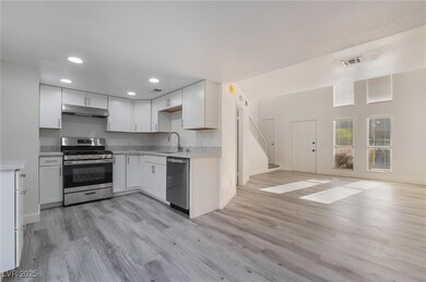 Kitchen with a sink, appliances with stainless ste