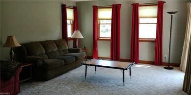 Living Room with 3 windows and a Patio Door