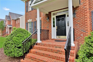Grand front entrance with brick steps and stoop.