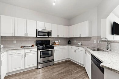 Kitchen with appliances with stainless steel finis